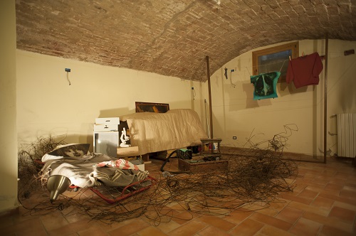 A. M. HOCH, Diary of a Young Boat in Three Movements: Young Boat in Bed (Third Movement), performance/ installation with cot painted mirror on pilllow, wires, found objects; dimensions variable, Cartoleria 18 Società Cooperativa; 2013