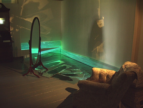 A. M. HOCH, interstices, DETAIL of parlor: site-specific installation with interior mural, paintings on mirrors, video projections on base boards, bureau with camera obscura, and video loops hidden inside various furniture and household objects, 12 x 15 feet: 2002