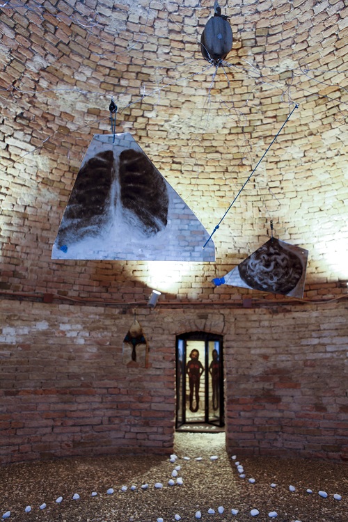 A. M. HOCH; Metamorfosi di una barca: first level of installation (circular basement floor) in castle tower: central room with painted mirrors suspended with wires and pulleys, with three alcoves with painted mirrors; approximately 13.78 ft (height) x 21.5 ft (diameter); 2011