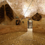 A. M. HOCH; Metamorfosi di una barca: first level of installation (circular basement floor) in castle tower: central room with painted mirrors suspended with wires and pulleys, with three alcoves with painted mirrors; approximately 13.78 ft (height) x 21.5 ft (diameter); 2011