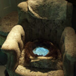 A. M. HOCH, interstices, DETAIL: ripped-open chair with embedded video loop of child's hand touching surfaces inside the house, 45 inches x 31 inches x 33 inches, 2002