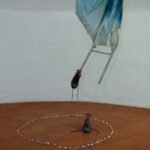 A. M. HOCH, third level of castle tower: Metamorphosis with Umbrella; mixed media including umbrella, resin, metal, and oil paint; approximately 73.6 x 23.6 inches; 2010/2011