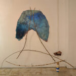 A. M. HOCH, Here Now Am (Breathing Vessel), studio installation, mixed media including oil on resin-coated fabric with embedded wires; painted mirror; branches; stack of masking tape; approximately 224 x 244 cm (88 x 96 inches), 2014